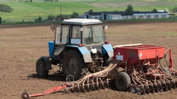Tractors planting farm fields